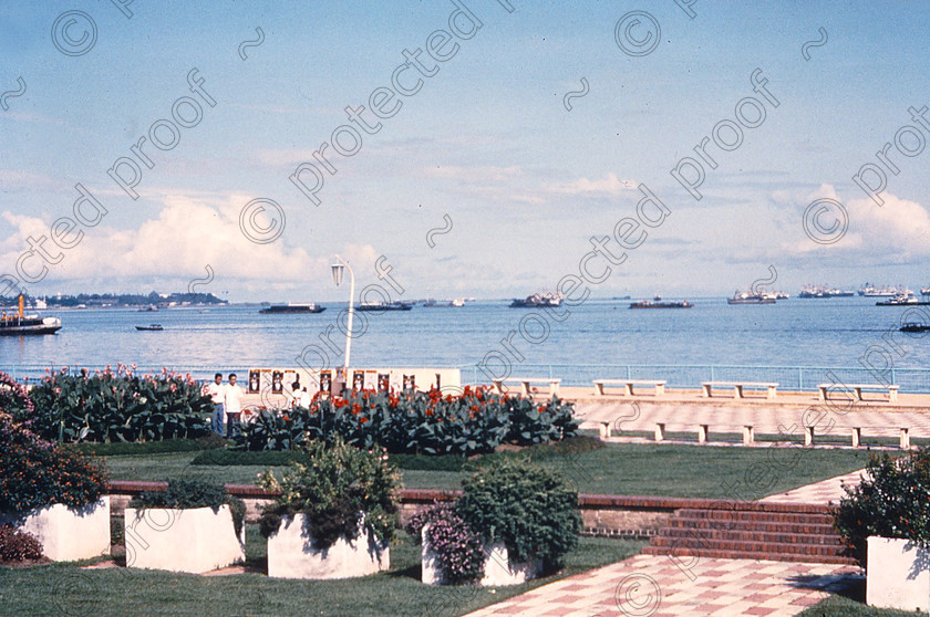 PMR.SP-04 
 Singapore 1958: Queen Elizabeth Walk, laid out for the queen's coronation, with ships in Singapore Roads behind. (Now inland, due to reclaimed areas of land). 
 Keywords: British colonies, nostalgia, historic, island, tropics, Far East
