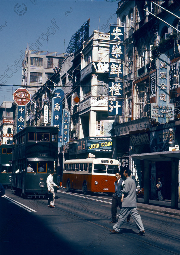 PMR.HK-03 
 Hong Kong 1958: Queen Street with ex-UK trams and local bus. 
 Keywords: British colonies, nostalgia, historic, island, tropics, Far East