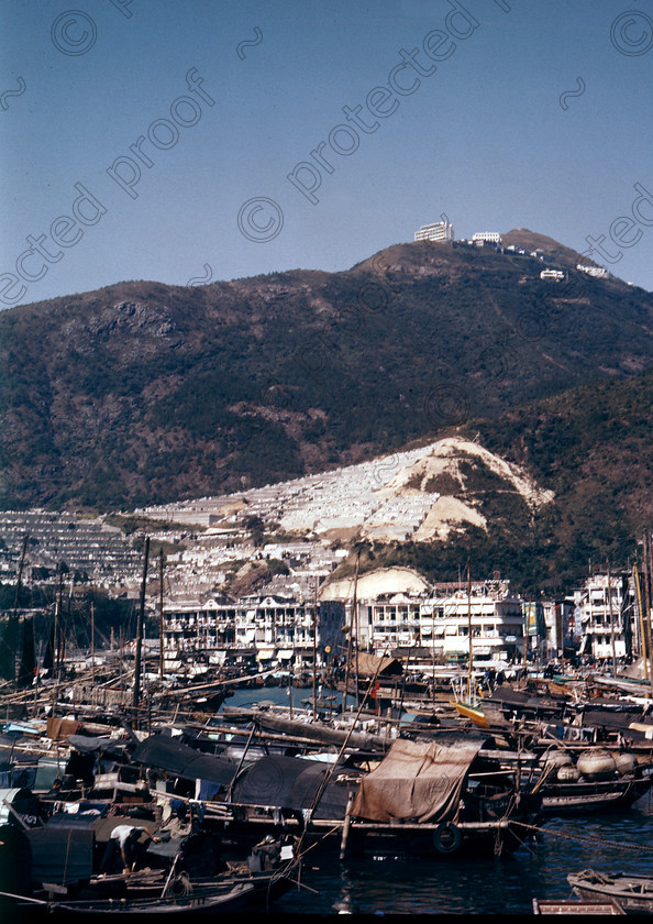 PMR.HK-34 
 Hong Kong 1958: view of Aberdeen fishing village and sampans from Aplichau Island. Behind, a Chinese graveyard on the mountainside, and hotels on the top. 
 Keywords: British colonies, nostalgia, historic, island, tropics, Far East