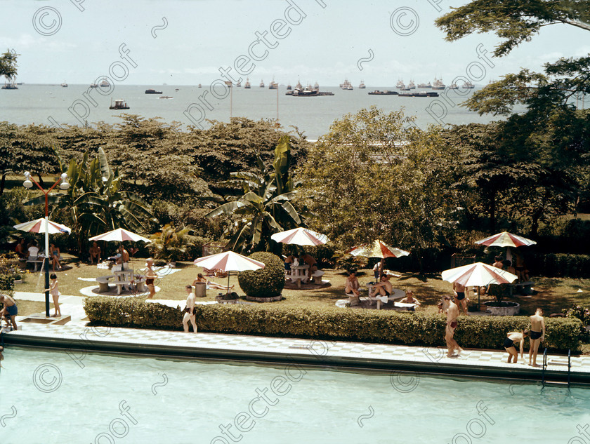 PMR.SP-14 
 Singapore 1958: the Nuffield Swimming Pool in the Britannia NAAFI Club, with ships in Singapre Roads in the background. 
 Keywords: British colonies, nostalgia, historic, island, tropics, Far East