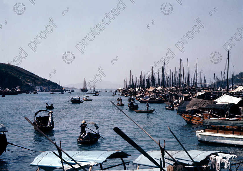 PMR.HK-30 
 Hong Kong 1958: sampans in Aberdeen fishing village with a forest of junk masts behind. 
 Keywords: British colonies, nostalgia, historic, island, tropics, Far East