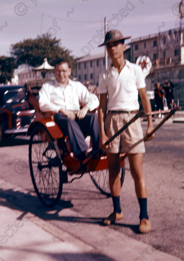PMR.HK-09 
 Hong Kong 1958: rickshaw with rickshaw-boy. 
 Keywords: British colonies, nostalgia, historic, island, tropics, Far East